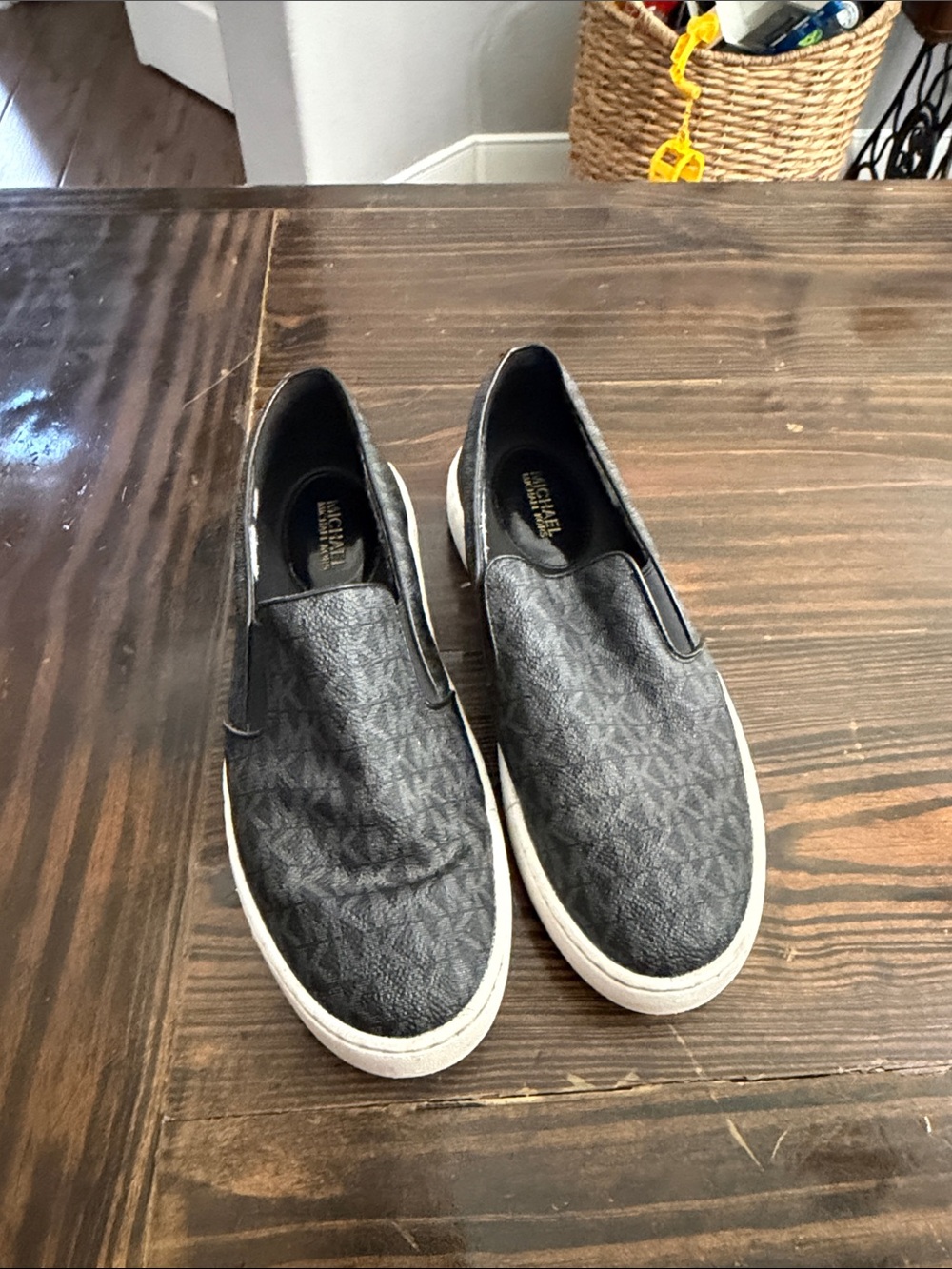 Michael Kors women’s Charcoal Monogram Slip-On Sneakers